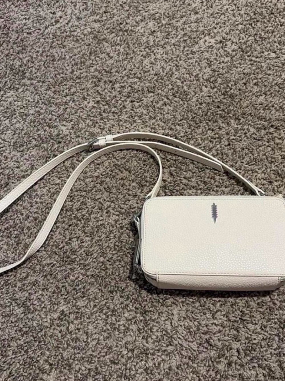White leather crossbody bag with adjustable strap